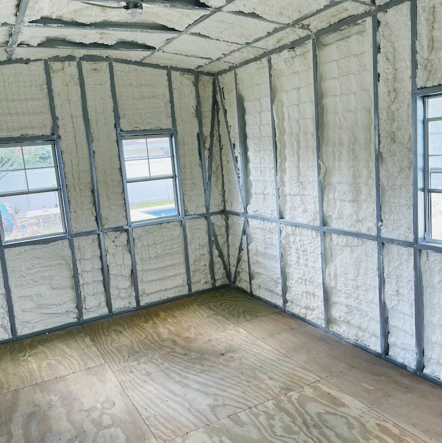 Closed-cell spray foam insulation applied to wall cavities in a residential project in Attica